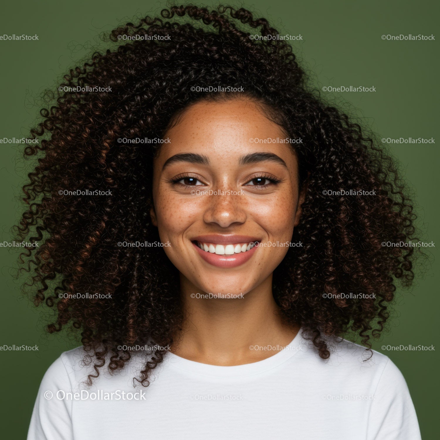Close-up Portrait of Smiling Woman with Curly Hair and Freckles