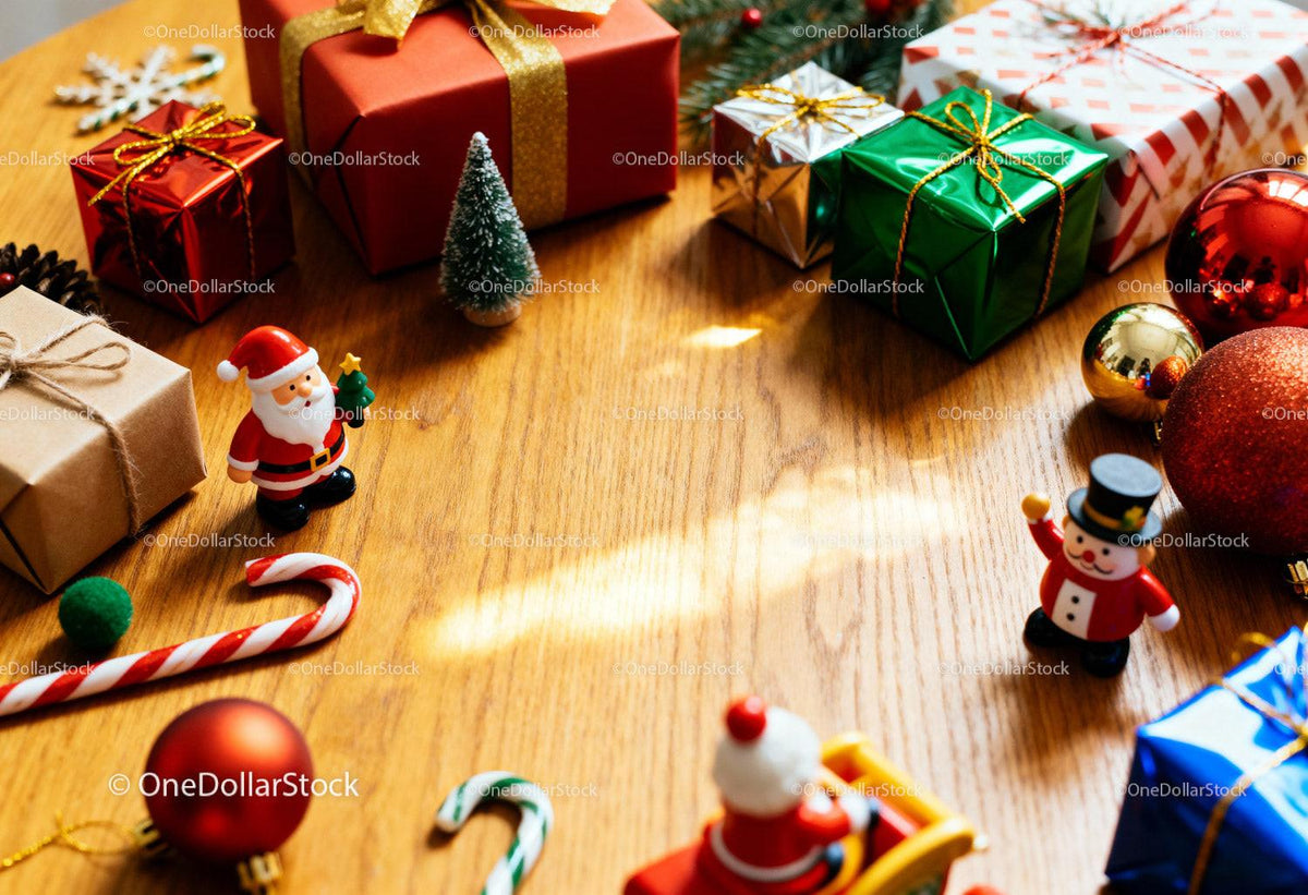 Festive Christmas gifts and ornaments on wooden table