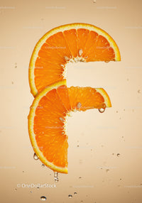 Fresh orange slices with water droplets on beige background