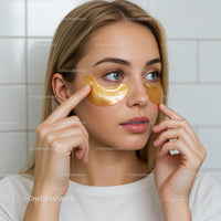 Young Woman Applying Gold Under Eye Patches for Skincare Routine