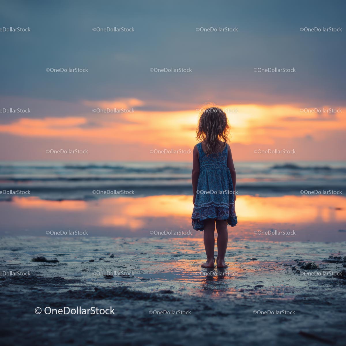 Silhouette of a Child at Sunset by the Ocean Shore