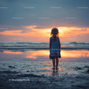 Silhouette of a Child at Sunset by the Ocean Shore