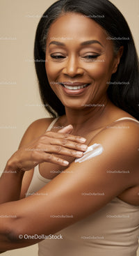 Happy Woman Applying Sunscreen in a Bright Skin Care Routine