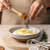 Close-up of Honey Drizzling over Yogurt in a Ceramic Bowl