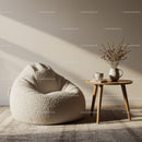 Cozy beige bean bag with side table and dried flowers