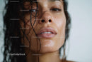 Close-up of a Woman with Wet Skin and Water Droplets