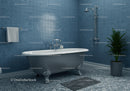 Classic clawfoot bathtub in modern blue tiled bathroom