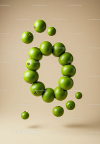 Fresh limes arranged in floating circle on neutral background