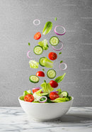 Fresh mixed vegetable salad ingredients in motion