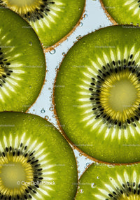 Close up of fresh kiwi slices in sparkling water