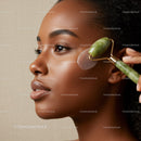 African American Woman Using Jade Roller for Facial Massage
