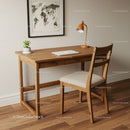 Cozy Wooden Desk with Laptop and Potted Plant in Minimalist Home Office