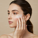 Beautiful Woman Applying Skincare Cream for Glowing Face
