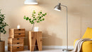 Cozy living room corner with modern wooden furniture and plants