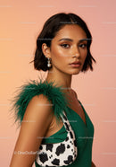 Elegant Fashion Model in Green Dress with Feathered Accessory and Animal Print Bag