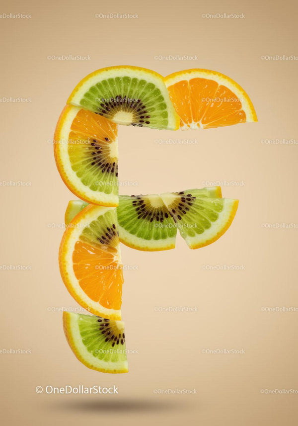 Fresh Kiwi and Orange Slices Arranged in Letter F