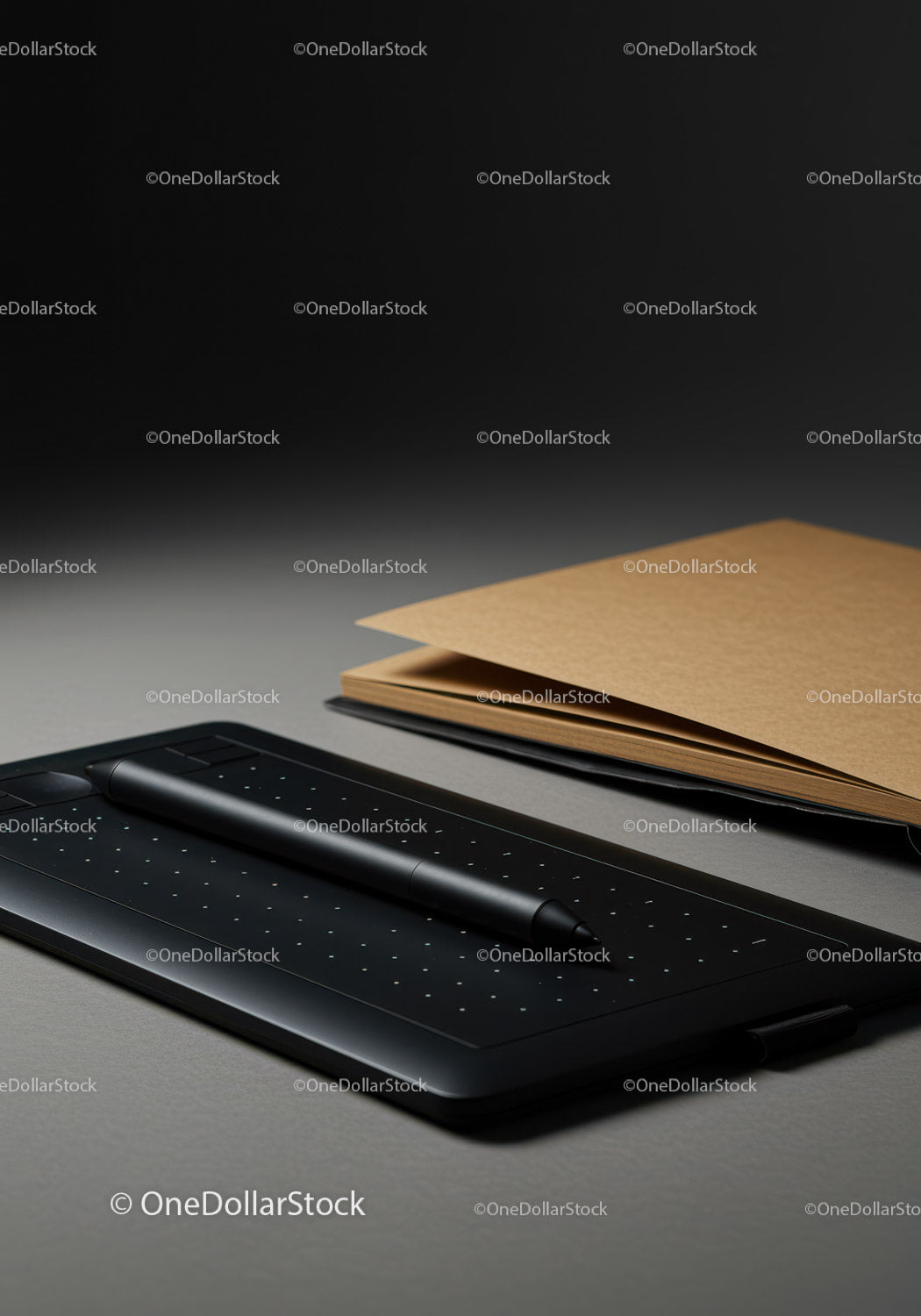 Nowoczesny czarny tablet graficzny z rysikiem na biurku