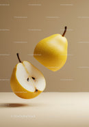 Fresh yellow pears with one cut in half on beige background