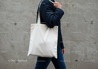 Person Carrying Simple White Canvas Tote Bag Outdoors