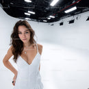Woman in White Dress in Bright White Studio with Studio Lighting
