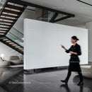 Blurred woman walking in modern minimalist lobby interior