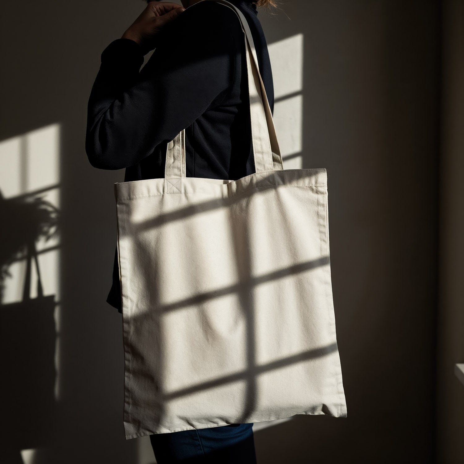 Person Holding Blank Canvas Tote Bag in Natural Light