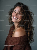 Joyful Woman with Wavy Hair Smiling in Studio Portrait