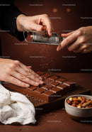Chocolate Bar with Cacao Nibs and Assorted Nuts on Wooden Board