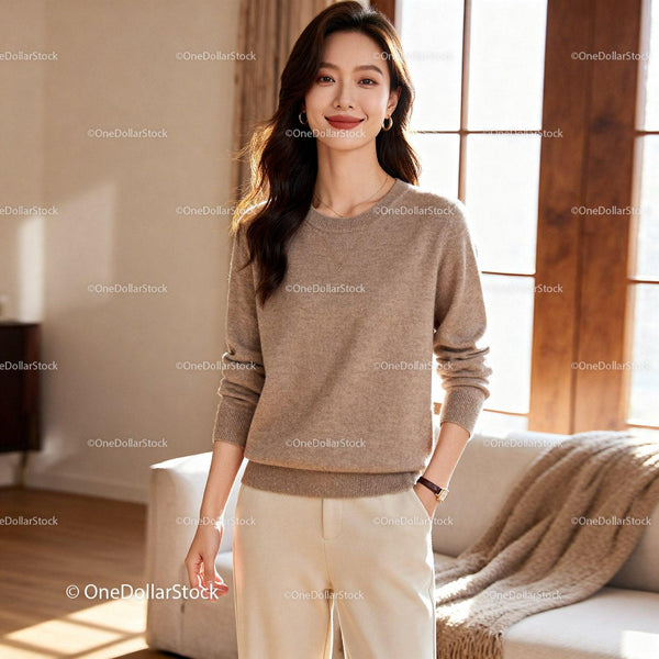 Smiling woman in cozy beige sweater at home