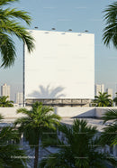 Blank billboard surrounded by palm trees in cityscape