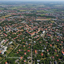 Aerial View of Suburban Residential Neighborhood with Green Parks and Red Rooftops