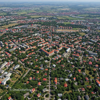 Aerial View of Suburban Residential Neighborhood with Green Parks and Red Rooftops
