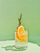 Refreshing sparkling drink with orange slice and rosemary