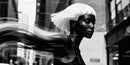 Stylish woman with white hair in urban black and white