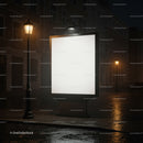 Empty illuminated billboard on wet city street at night