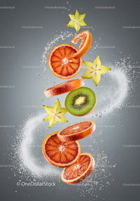 Sliced tropical fruits floating with water splashes