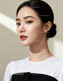 Portrait of a young woman with glowing skin and sleek hair
