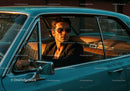 Stylish Man in Sunglasses Driving Vintage Car Interior Scene