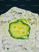 Frozen cucumber slice encased in clear ice cube