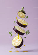 Sliced eggplant with olive oil droplets and herbs