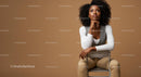 Stylish Confident Woman Sitting on Chair in Modern Studio
