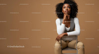 Stylish Confident Woman Sitting on Chair in Modern Studio