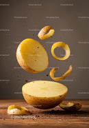 Fresh peeled potato slices floating with soil particles
