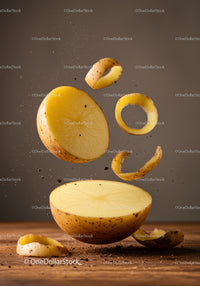 Fresh peeled potato slices floating with soil particles