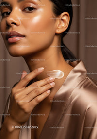 Close-Up of a Woman Applying Cream for Healthy Skin in Elegant Satin Robe