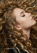 Closeup of serene woman with curly blonde hair