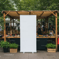 Outdoor market stall with fresh herbs and treats