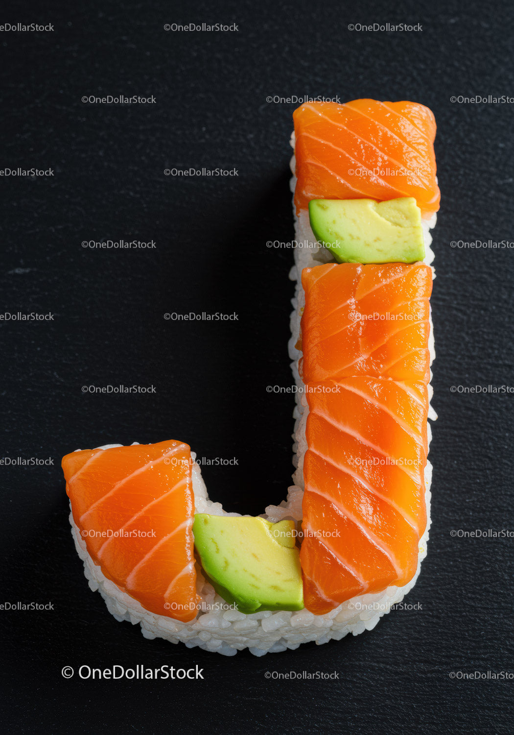 Sushi shaped like letter J with salmon and avocado