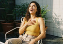 Young Woman Laughing Relaxing Outdoors in Sunny Garden