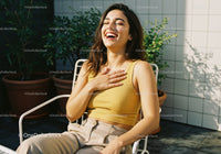 Young Woman Laughing Relaxing Outdoors in Sunny Garden